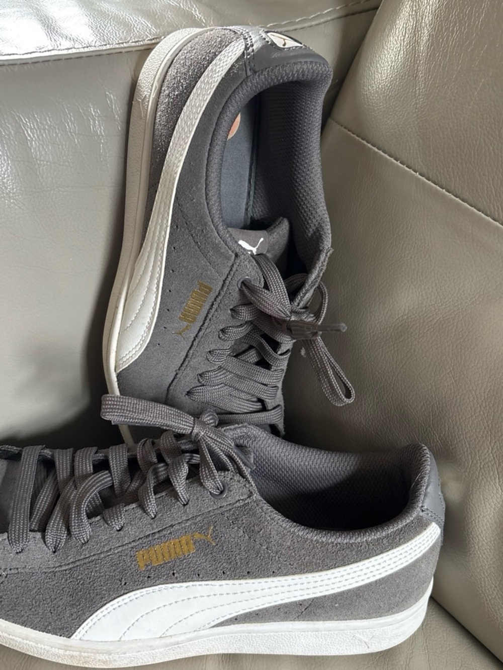 Puma women’s Classic Suede Sneaker in Gray and White